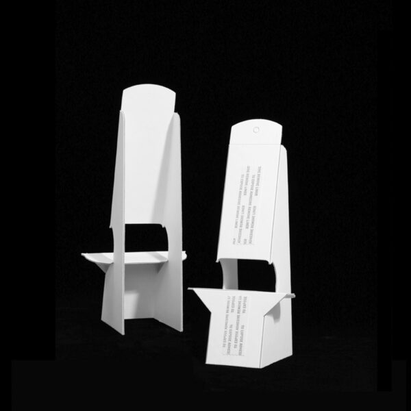 Two white easels with tape.