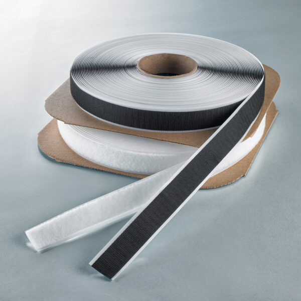 Velcro tape hook and loop on rolls in black and white.