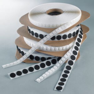 Black and white Velcro hook and loop coins in small and large sizes on rolls.