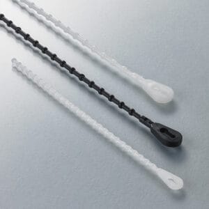 Beaded, plastic locking straps in white and black nylon.
