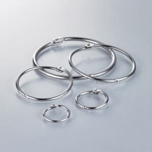 A collection of silver-colored metal snap rings in small, medium and large sizes.