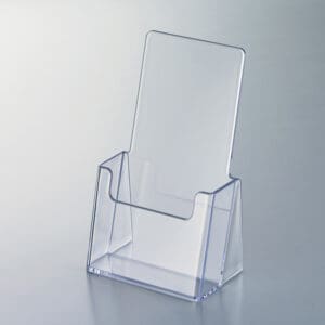A small-sized, clear, polystyrene, countertop literature holder.