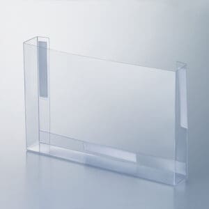 A flexible plastic, clear, fold-up literature box with foam tape mounting tabs.