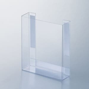 A flexible plastic, clear, fold-up literature box with foam tape mounting tabs.