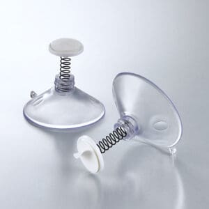 Two suction cups with attached springs and adhesive-backed sign-mounting discs.