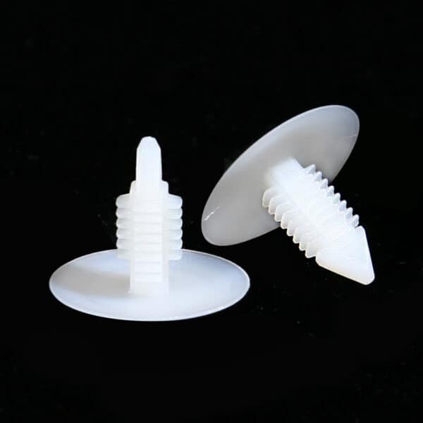 Two wide-head Christmas tree clips in white plastic.