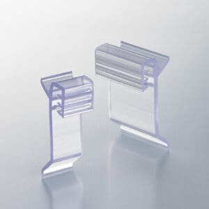 Two Popco finned small-sign holders for use in 1.25 inch shelf channels.