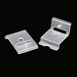 Two Popco self-piercing sign holders for use in 1.25 inch shelf channels.