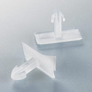 Two of Popco's ad pad clips, for use in 1.25 inch shelf channels.