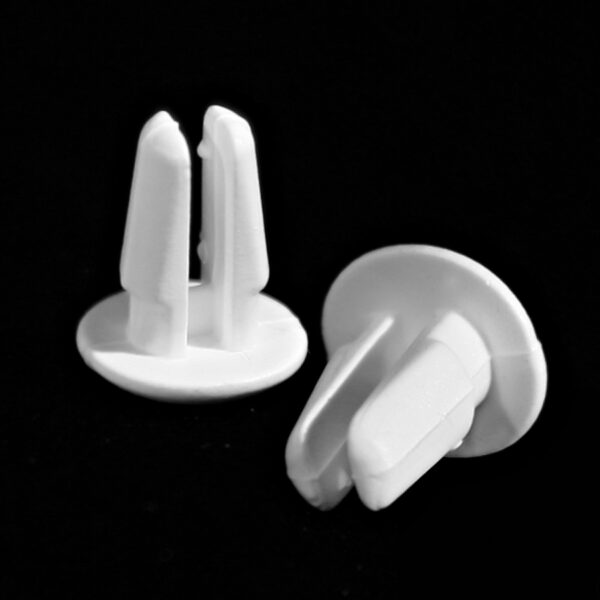 Small, plastic, shelf push-pins in white.