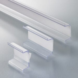 Shelf-edge adapter sign mounts with adhesive strips for use in store shelf-channels.