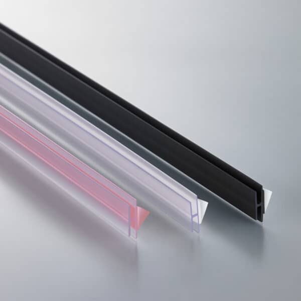 Three thin, plastic, H-channels in clear and black with either film or foam adhesive strips on the back.