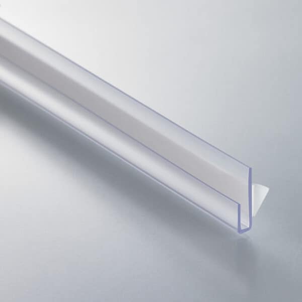 A thin, clear plastic, J-channel with a white foam adhesive strip on the back.