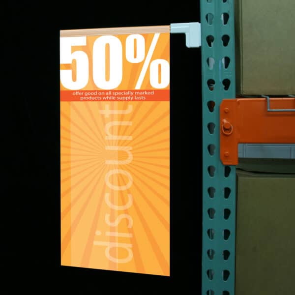 A store sign held in place by a clear plastic sign gripping rail with a magnetic base.