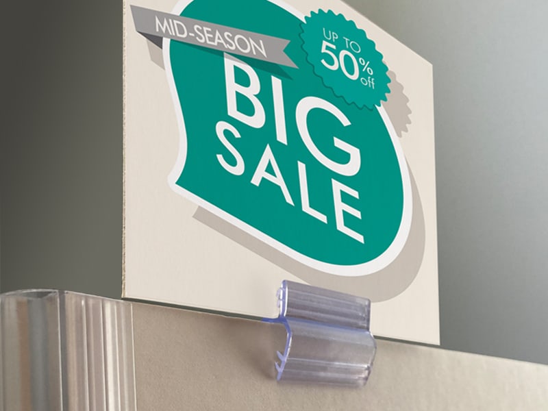 Popco saddle clip joining small sign to thick poster stock.