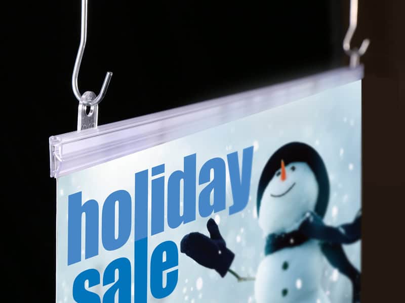 Popco's sign hanging rail and hanging hardware supports a Christmas marketing poster.