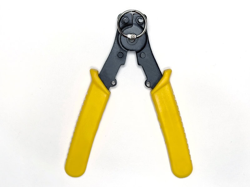 A seal-ring pliers shown with a steel book ring.