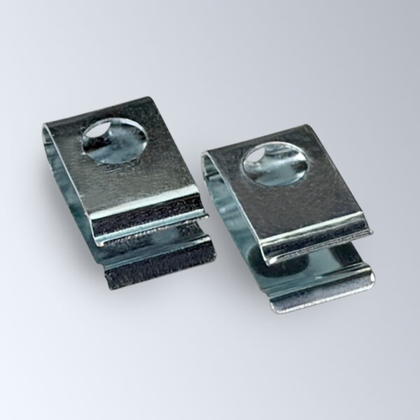 Two of Popco's aluminum banner clips, used to create hanging points on a variety of poster hanging rails.