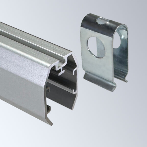 A Popco aluminum banner clip shown being inserted into an aluminum shroud.
