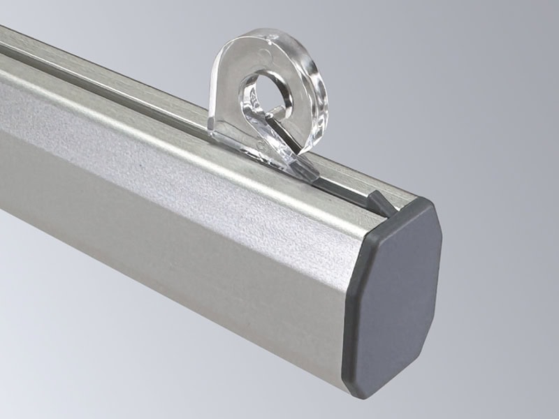 Popco’s aluminum Snaprail™ kit assembled, showing the aluminum shroud, a grey end cap, and a clear plastic banner clip.