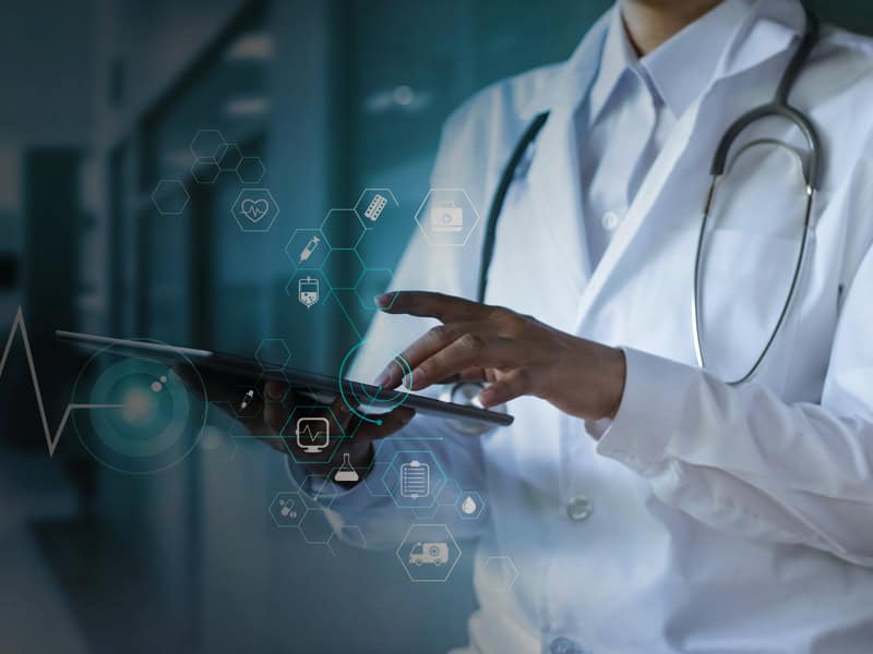 A photo of a medical professional with graphics added, meant to indicate technology in medicine.