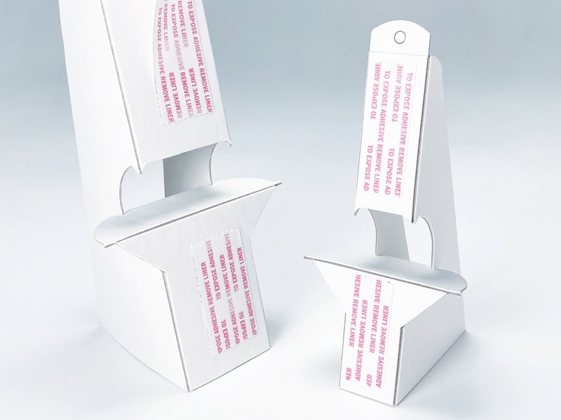 White chipboard easels with tape from Popco, Inc.